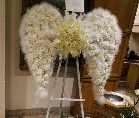 #angelwings out of fresh flowers. Great for anyone who loves angels or who is an angel. 36" wings with a dozen white roses in center $650.00