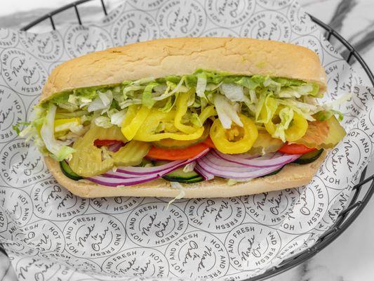 This is the veggie sub featuring tomatoe, red onion, cucumber, banana peppers, lettuce, and pickles.