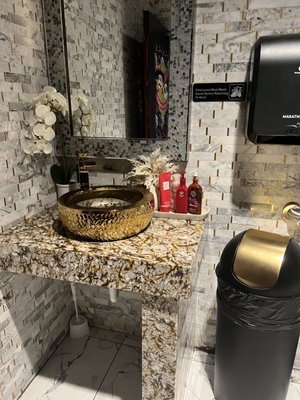 Love the gold in the bathroom