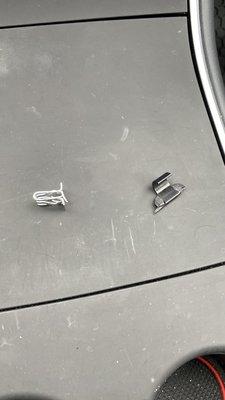 Broken cable management hook and molding clips found in car.