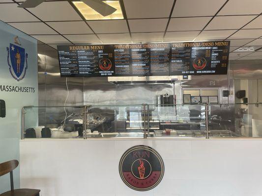 Counter with logo and menu board