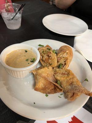 Jambalaya Egg Rolls with a Cajun cream sauce dip.