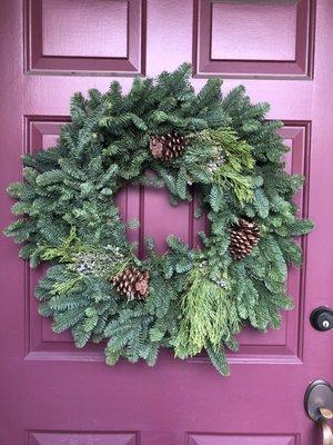 Picked up this huge fresh wreath for 25 bucks ... comes with built in hook ready to hang!