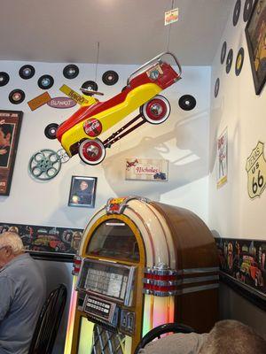 An old coca-cola petal car & old juke box!!!