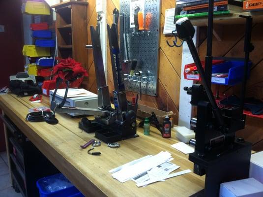 Main workbench with truing stand, paperwork and Morizumi spoke machine.