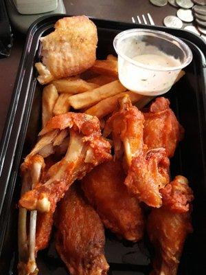 Very dry hot wings with next to no sauce. Precooked, frozen wings they drop in fryer for 5 minutes! The fried fish in the corner wasn't good