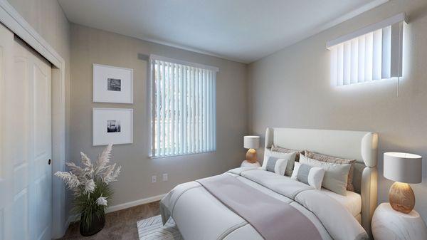 Bedroom featuring large windows and carpeted floors.