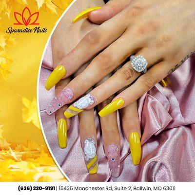 Embrace the beauty of fall with our stunning yellow nails adorned with lovely flowers! A delightful way to celebrate the season!