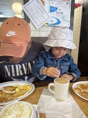 Regular Bowl of Grits Regular, Regular Hashbrowns, scrambled Cheese 'N Eggs, biscuits and steak