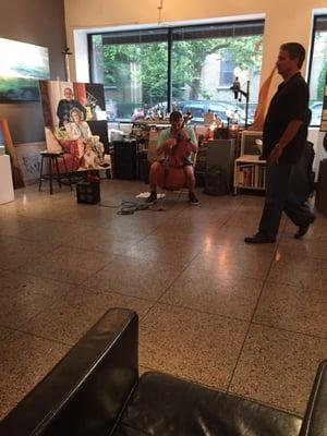 Guy's playing chello super dope during art walk