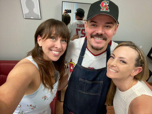 Papa Padre aka Gus, our piercing artist, my bestie and I, and a new piercing on our flat.