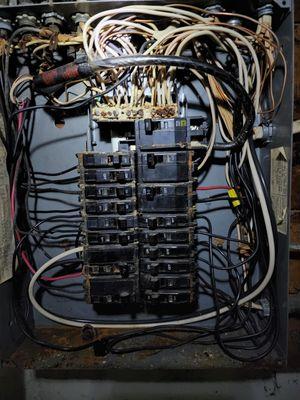 Example of deteriorating load center in basement. Neutral bar has disintegrated!