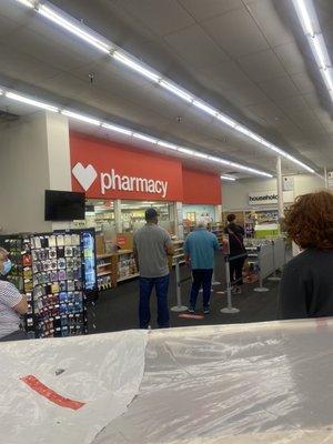 All of these people in line. With two  tech, one pharmacist, who didn't help anyone and one other assistant