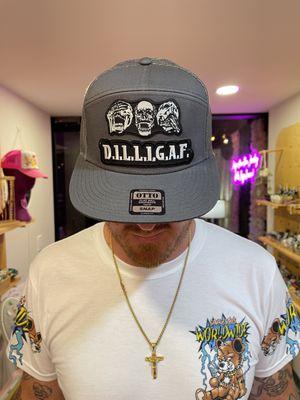 Men's custom Otto Flatbill SnapBack hat with embroidered patches. Come make your own at Tiny Weld Permanent Jewelry and Hat Bar!