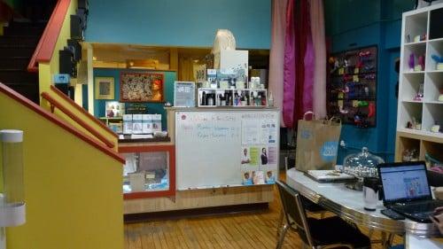 Here we see the entrance to the stairs, our display cases, and table.