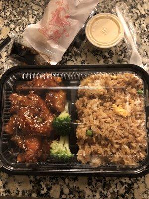 Sesame chicken with fried rice and egg roll