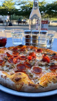 Italian Sausage pizza with live music by the lake