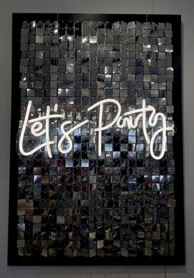 Let's Party Neon Sign with Sliver Backdrop.