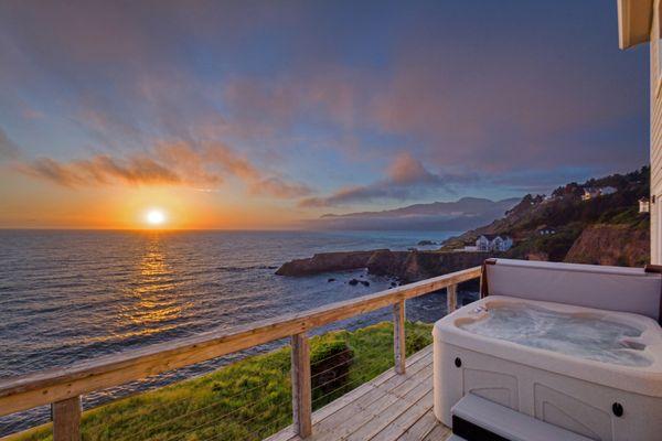 Sunset view from the Deck of the unit "Exquisite Oceanview" in Shelter Cove, CA All our units have Oceanview Hot Tubs.