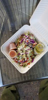 2 Sopes.  Asada and carnitas are hiding underneath the lettuce.