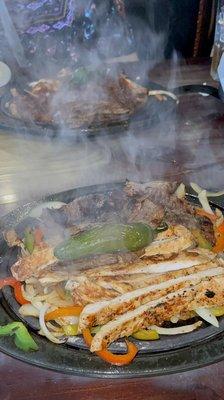 Smoking hot fajitas come guac ,pico ,rice ,beans sour cream ,cheese ,tortillas very yummy.