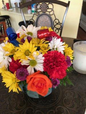 Actual flowers received. Chrysanthemums and daisies? One random orange rose? Embarrassing.