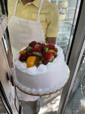 Vanilla Cake Filled with Strawberry and Vanilla Cream with pastry layers and fruit topping California Cake