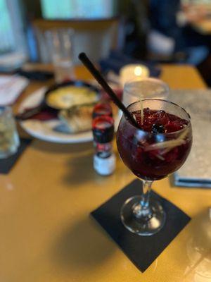 Pomegranate and Pear Sangria. Background: Fontina Cheese and bread Appetizer