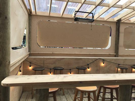 Outdoor bar space with sidewalk window ordering system/drink delivery