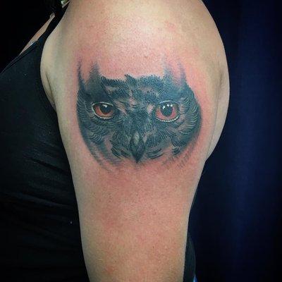 Owl tattoo with a cool design and dark element to it.