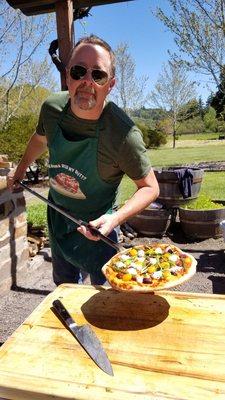 Jay fires up the pizza oven for our guests. It's our summertime tradition.