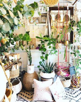 Plants and home decor, crystals, outdoor rugs and handmade gifts in an open-air, tropical garden setting