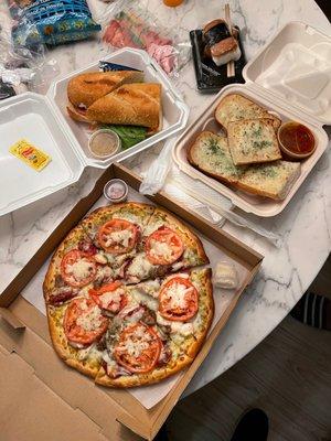 Cheese bread , pesto pizza with pepperoni and sausage, and Amina sub! All very good!!!