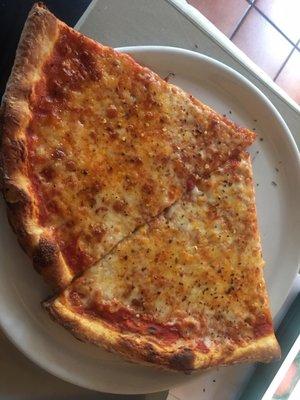 2 Cheese Slices Served On A Dish