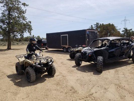 Logan is ready for our ride at four corners staging area on a 2019 Yamaha 450 Kodiak ATV.