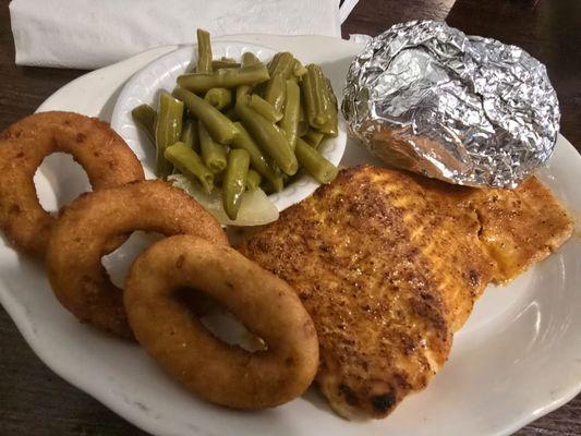 broiled salmon with green beans, baked potato, and hush puppies