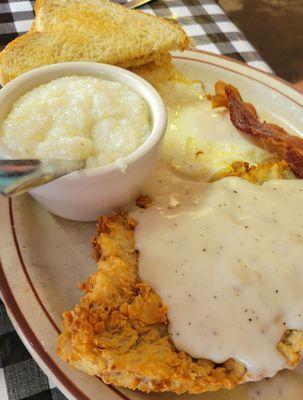 Chicken fried steak and grits.