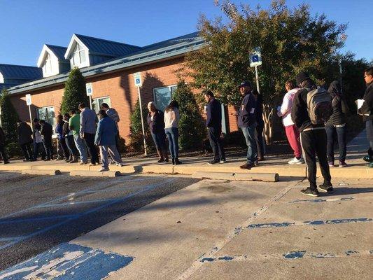 People waiting in line before the Mva opens