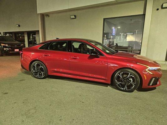 2025 Kia K5 GT series in Runway Red