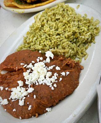 Cilantro rice and Frijoles Refritos that come with tacos. Pretty decent.