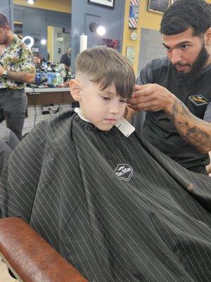 Luis P taking his time to get that fade just right