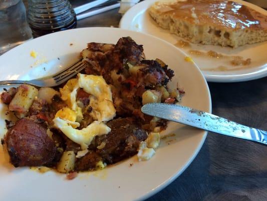 hash and eggs with some pancakes