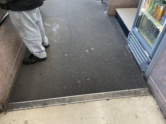 The floor next to the checkout station.