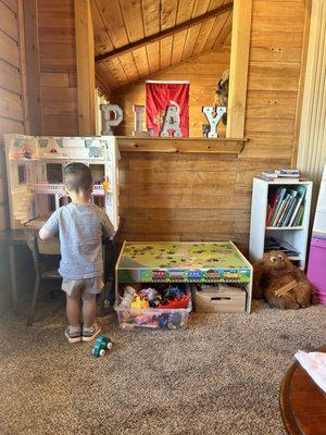 Children's area with plenty of toys, books, and coloring.