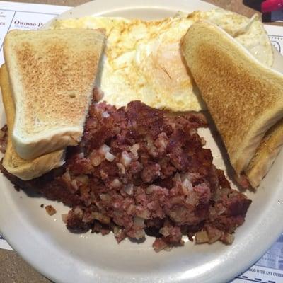 Corn beef and hash with two eggs over easy and Texas toast!