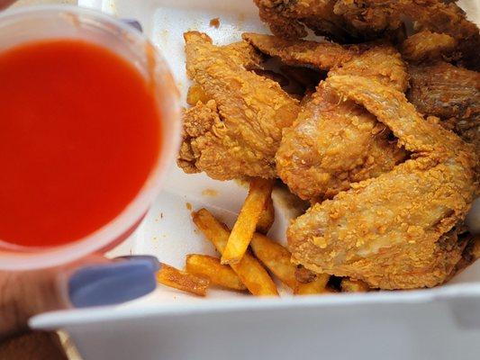 Wings, fries, mumbo sauce...I had already eaten most of my fries lol The food was nice and hot!