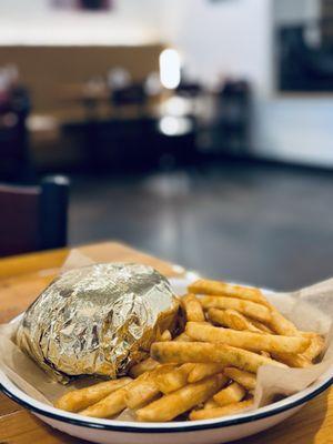 Oklahoma onion burger coming out hot and fresh wrapped in the gold foil