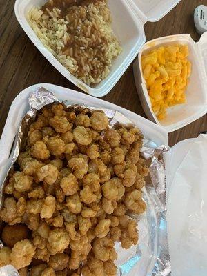 Popcorn shrimp with Mac n cheese and rice and gravy.