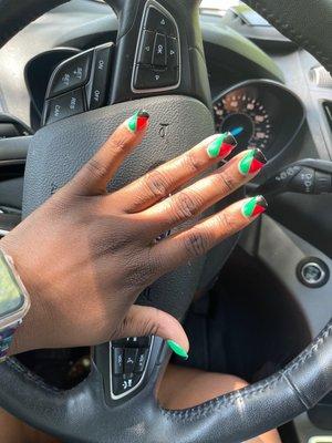 Red, green, and black nail design