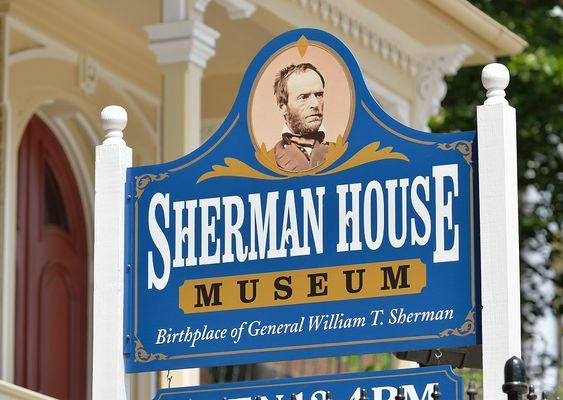 The bright blue and gold sign helps visitors find the museum in downtown Lancaster.